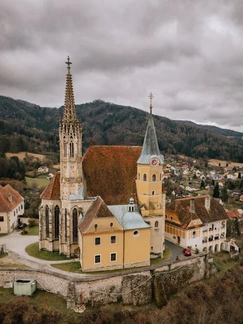 "Elegant facade of a 2025 mega mansion showcasing intricate architectural details and expansive windows, as seen in the 'Discover the Top 10 Mega Mansions of 2025 Now!' article."