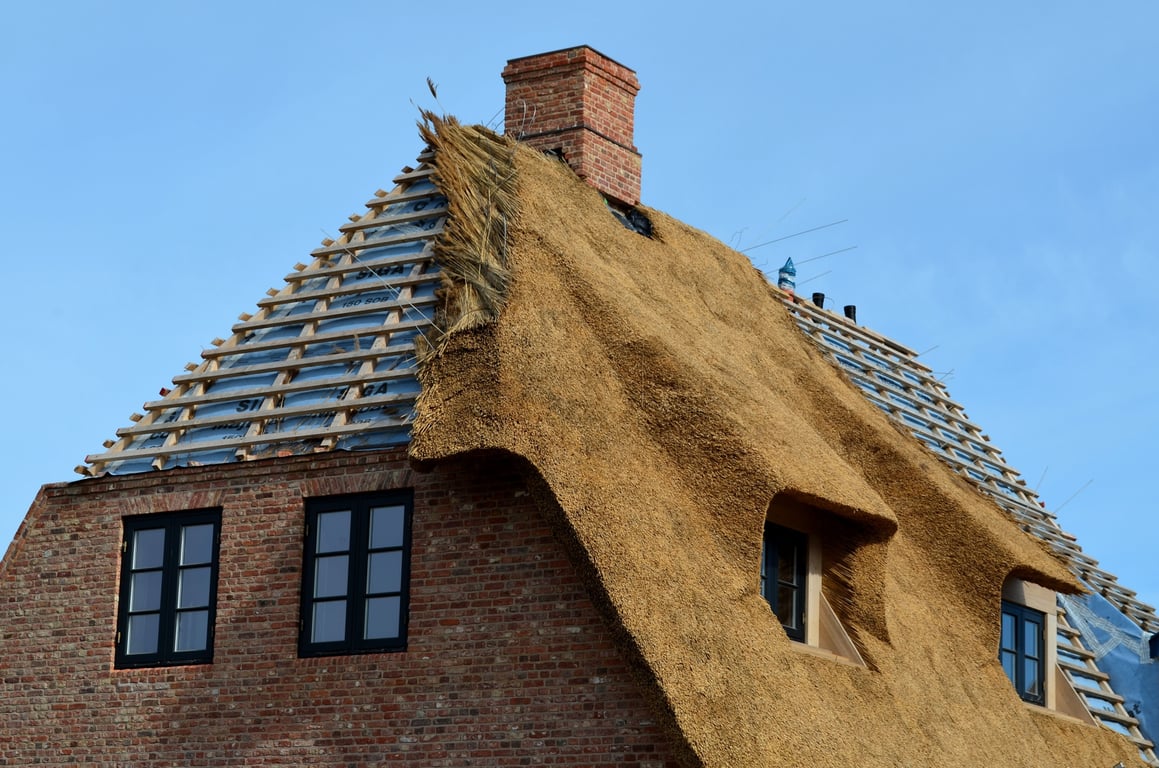 roofing contractor inspecting roof