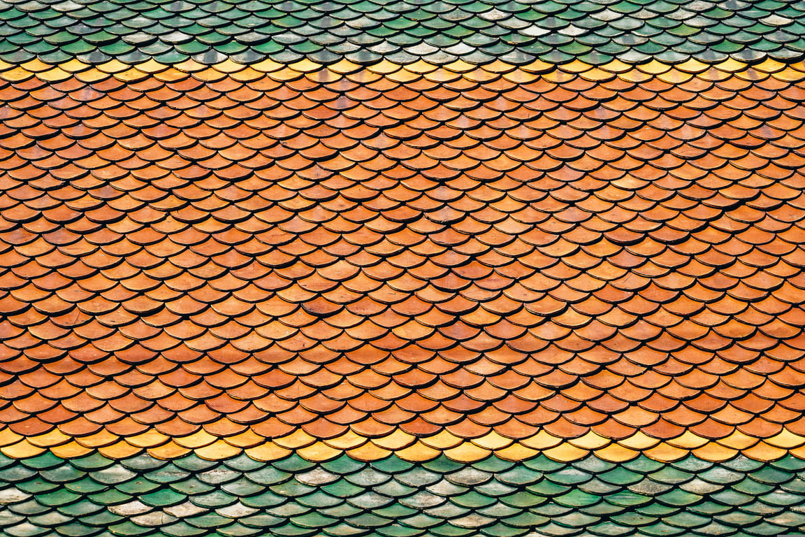 roofing contractor inspecting roof