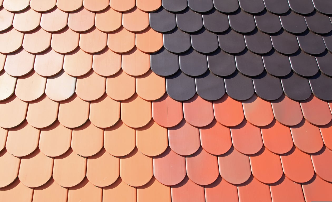 roofing contractor inspecting roof