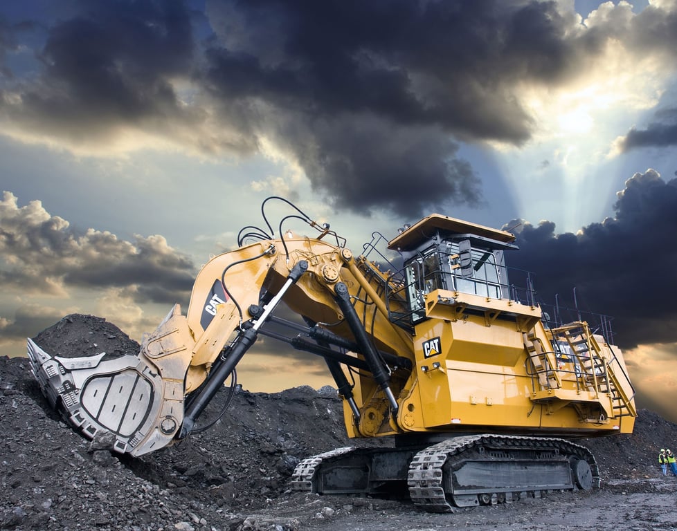 large hydraulic excavator loading dump truck