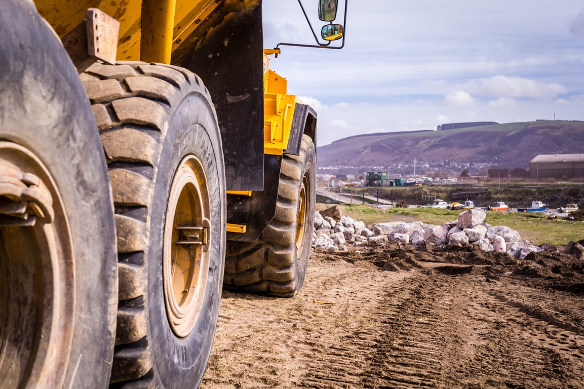 excavator and dump trucks