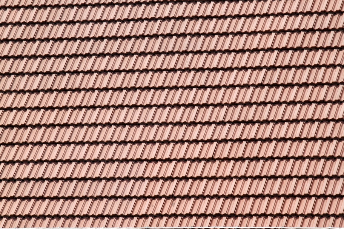 roofing contractor installing shingles