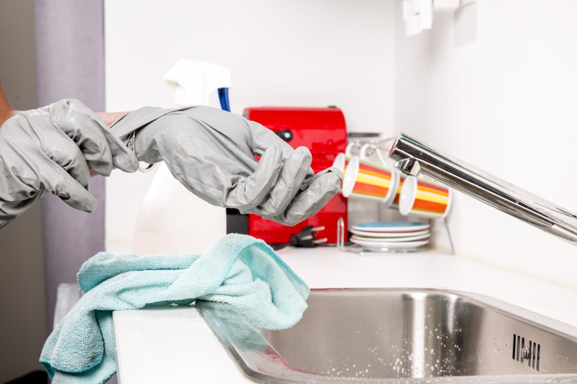 maid cleaning kitchen