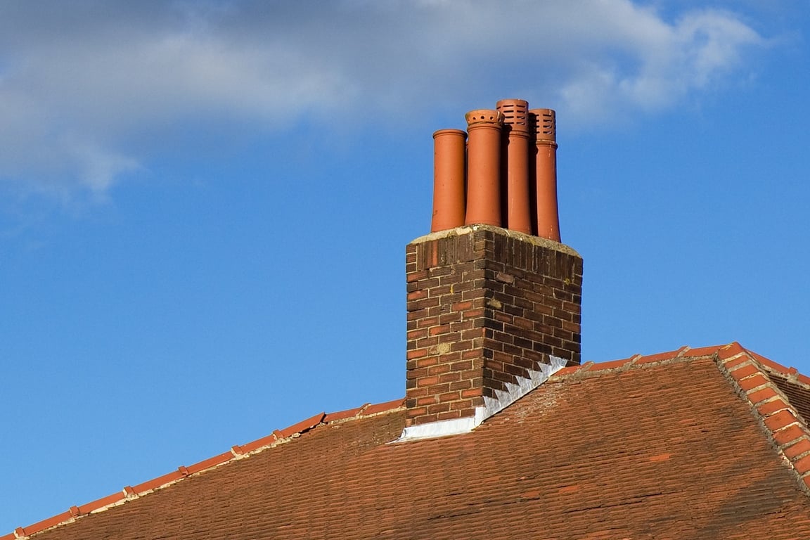 roofing contractor inspecting roof