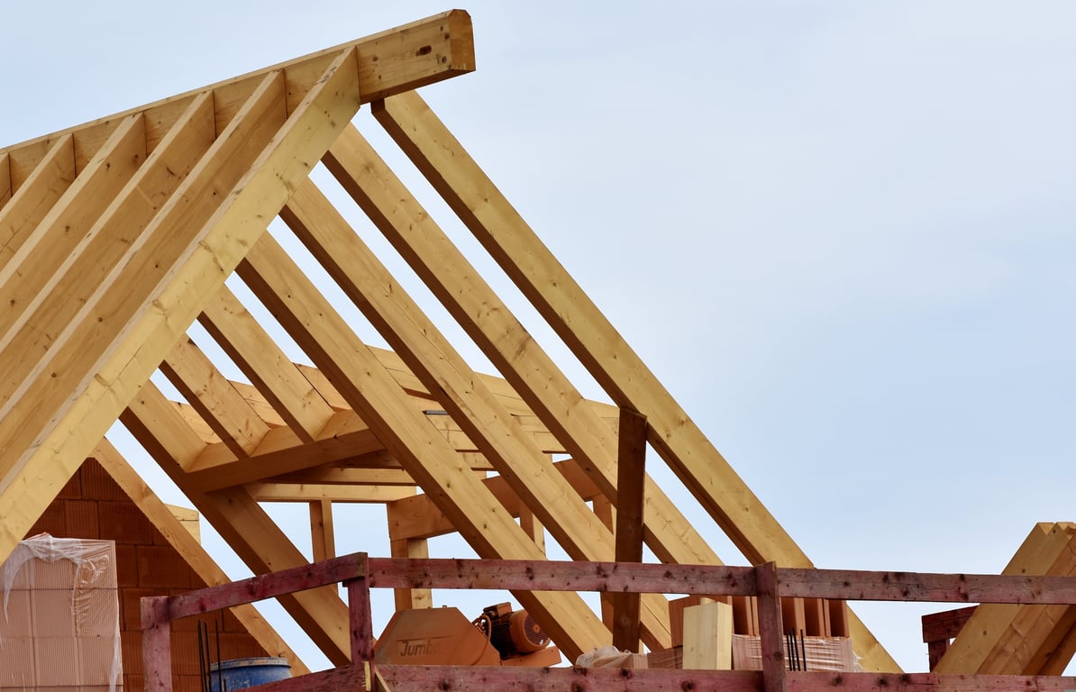 roofing contractor inspecting roof