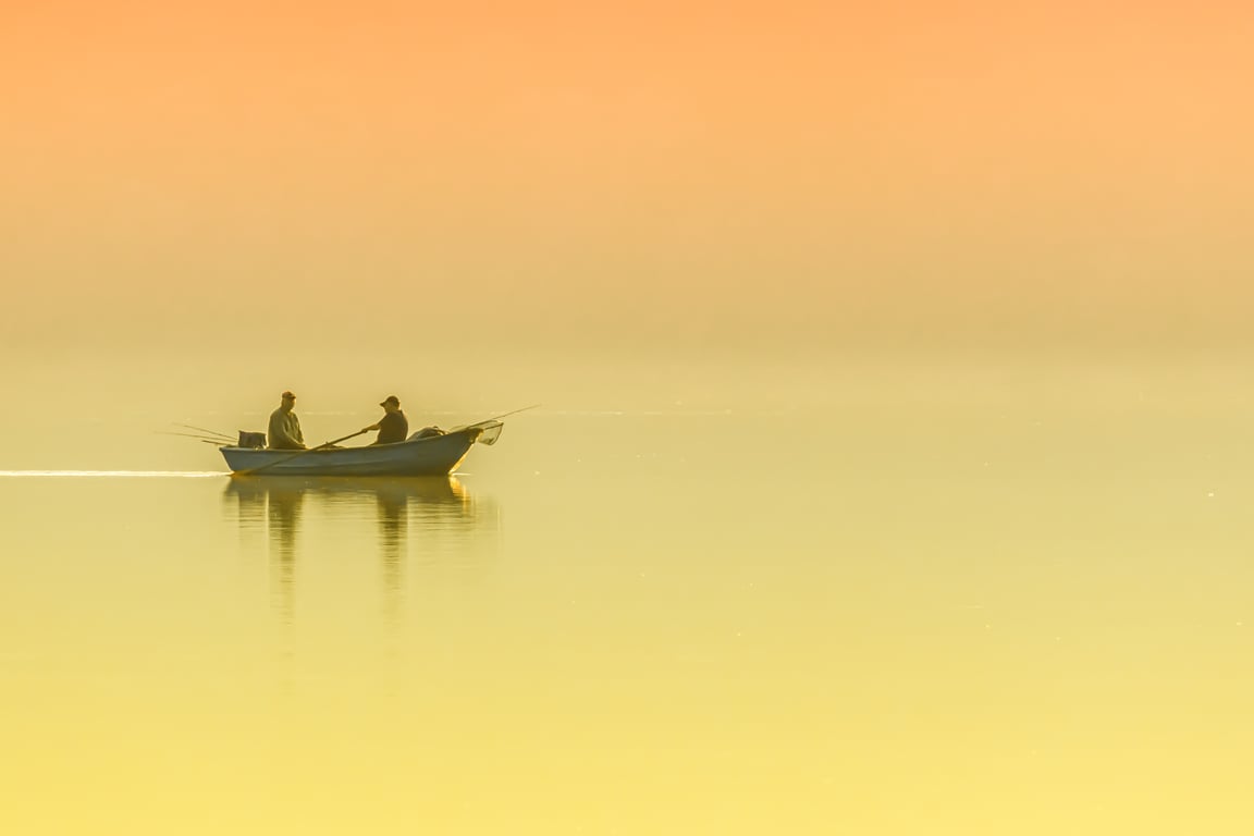 aluminum fishing boat on lake