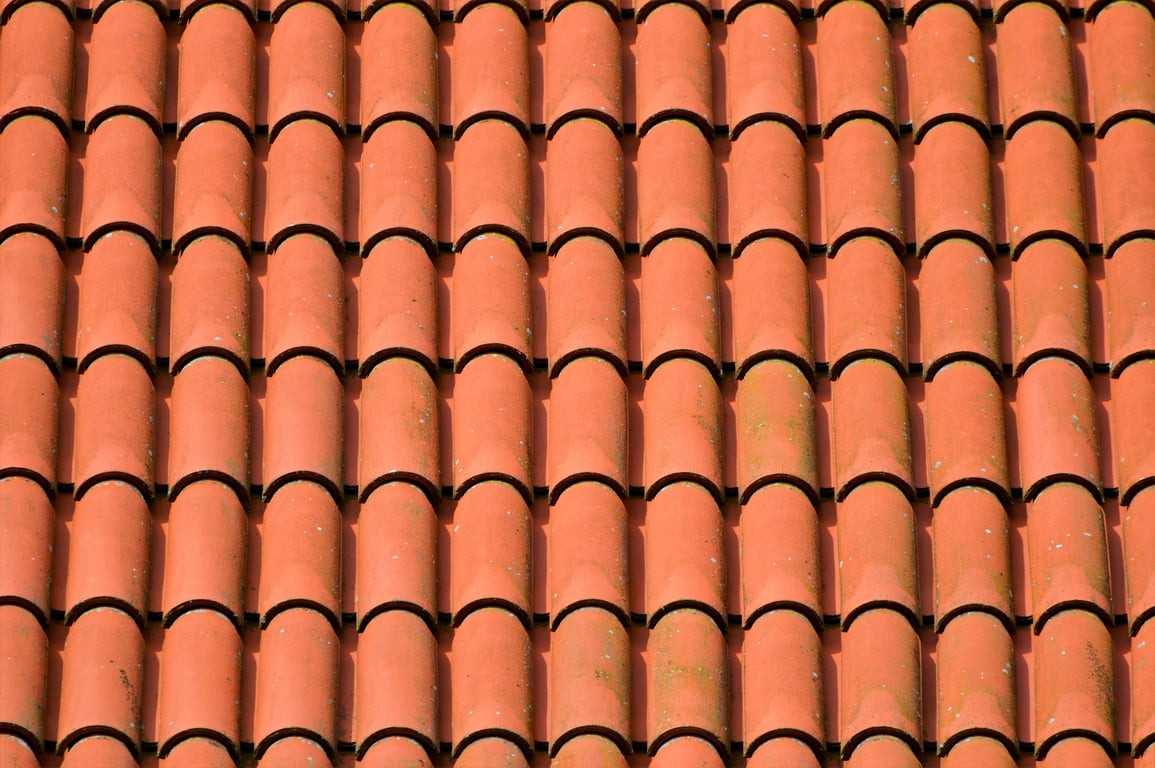 roofing contractor inspecting roof