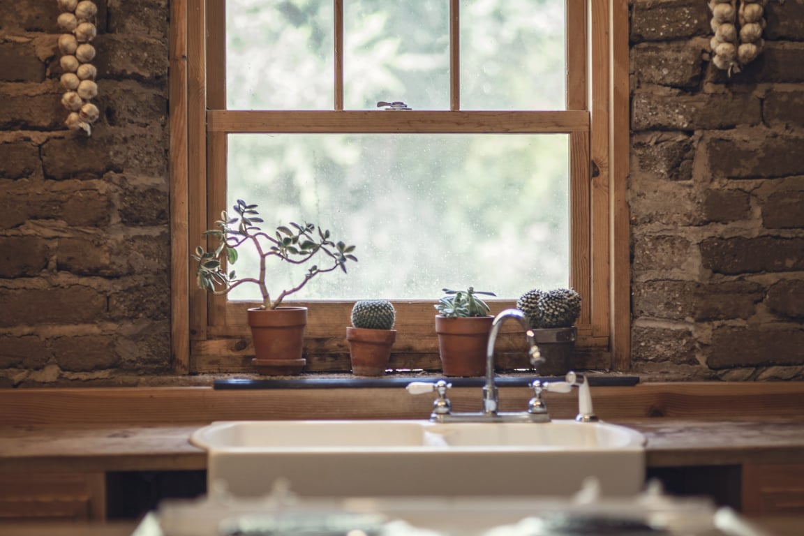 plumber unclogging kitchen sink
