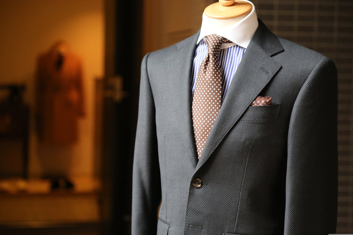 tailor fitting suit jacket