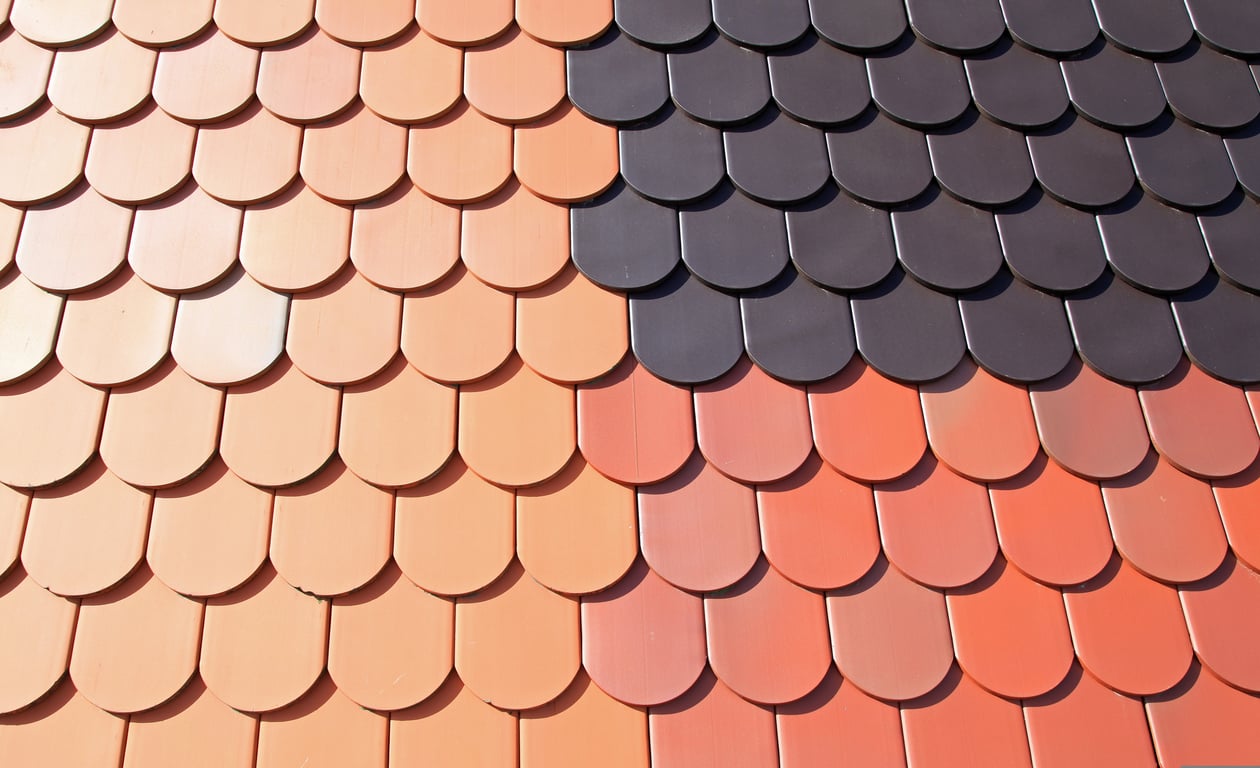roofing contractor inspecting roof