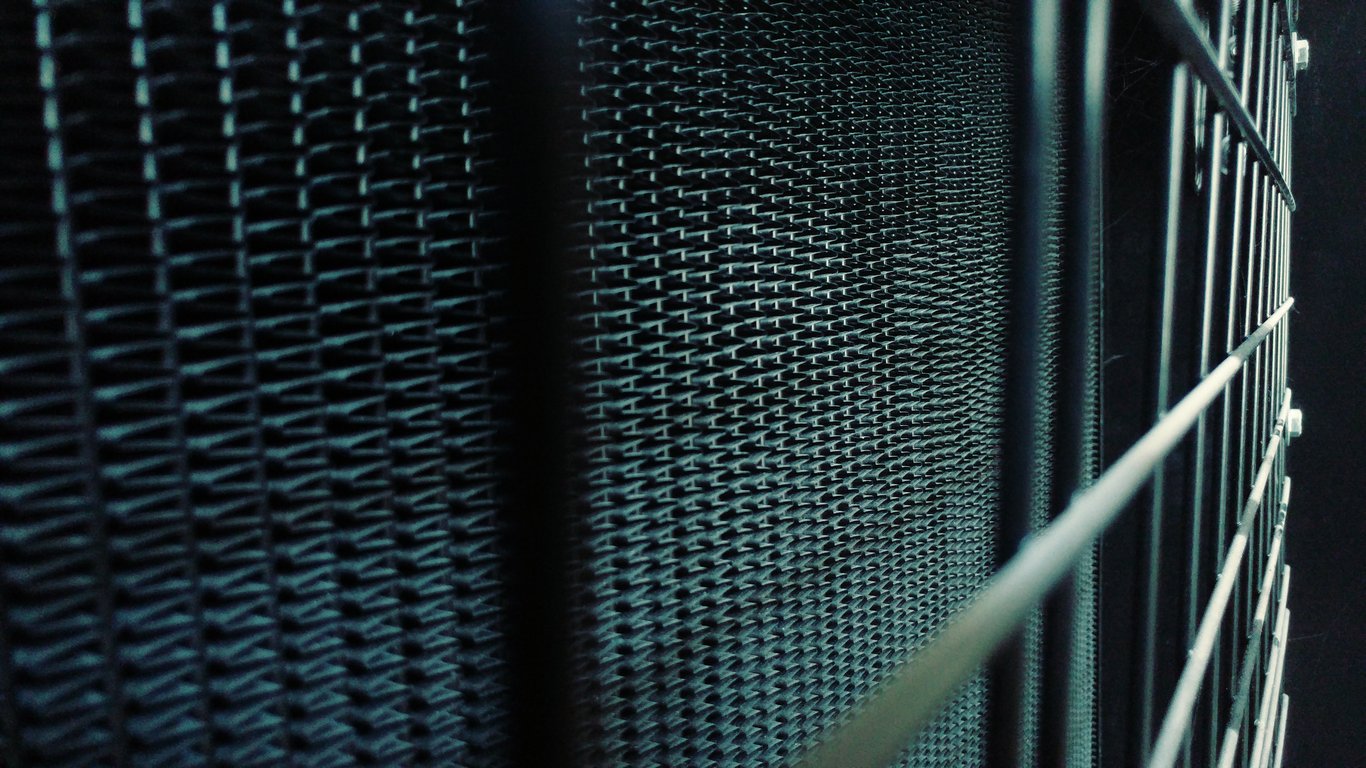 HVAC technician servicing outdoor condenser