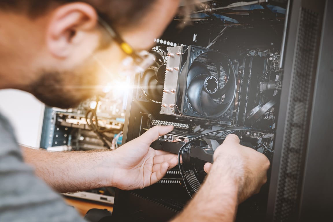 HVAC technician servicing air conditioner