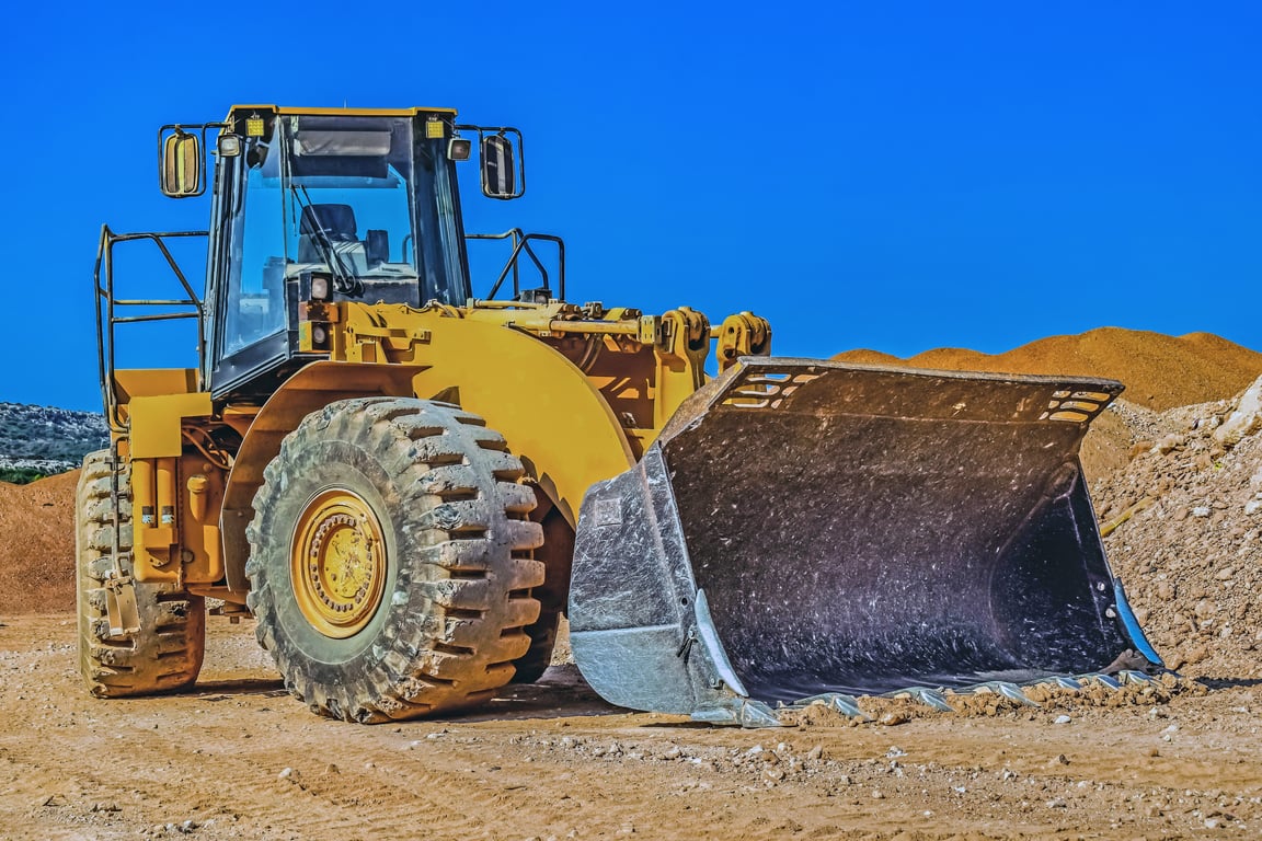 compact bulldozer grading residential site