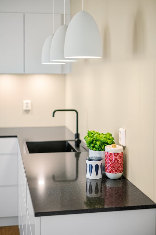 plumber unclogging kitchen sink