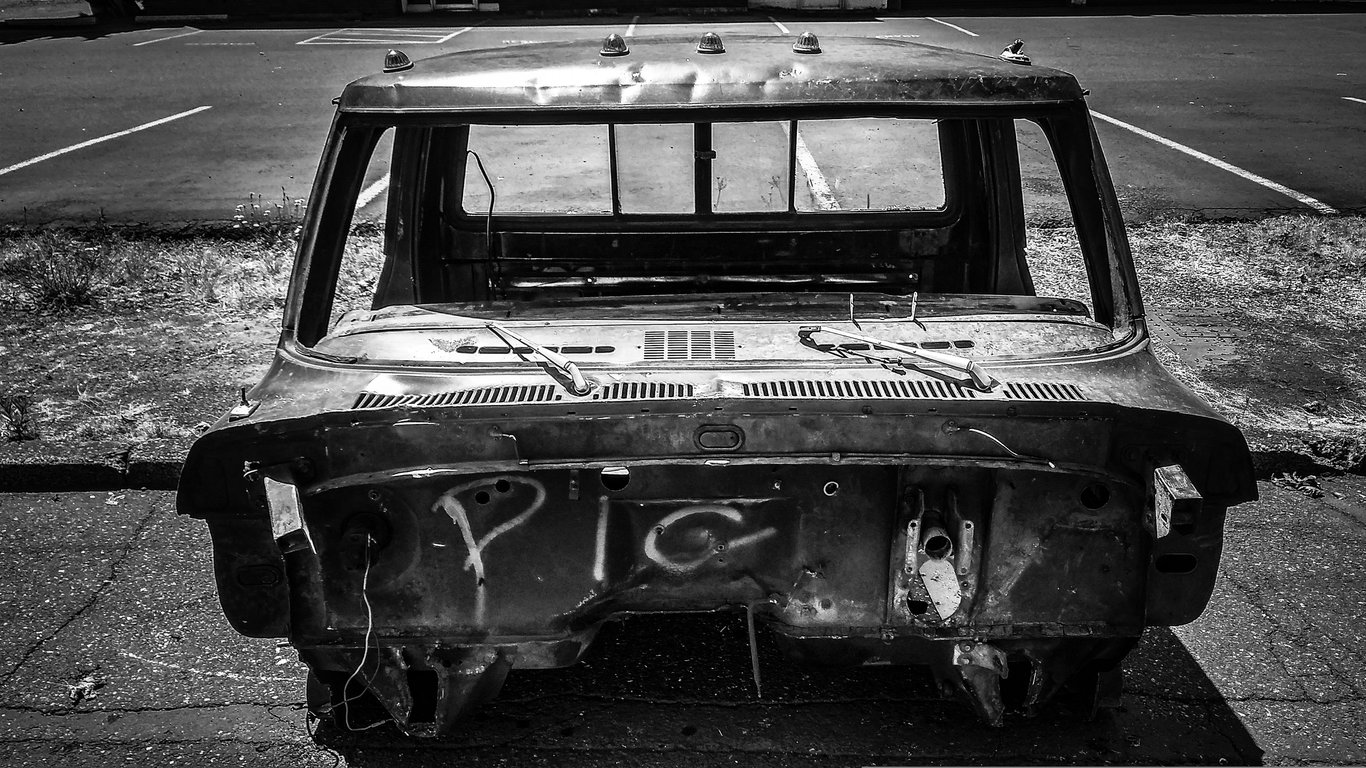 flatbed tow truck loading wrecked pickup