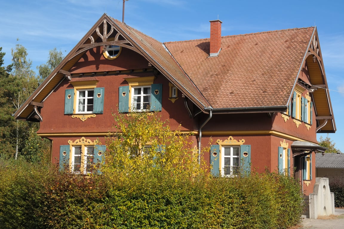 steep residential roof with chimney
