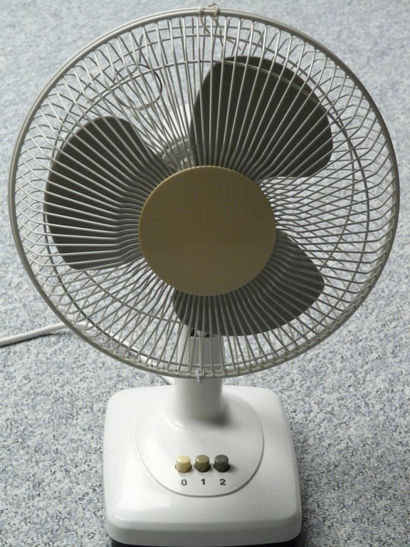 HVAC technician inspecting air conditioner