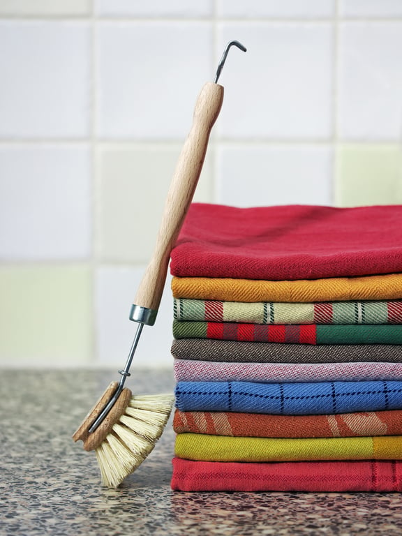 housekeeper cleaning kitchen