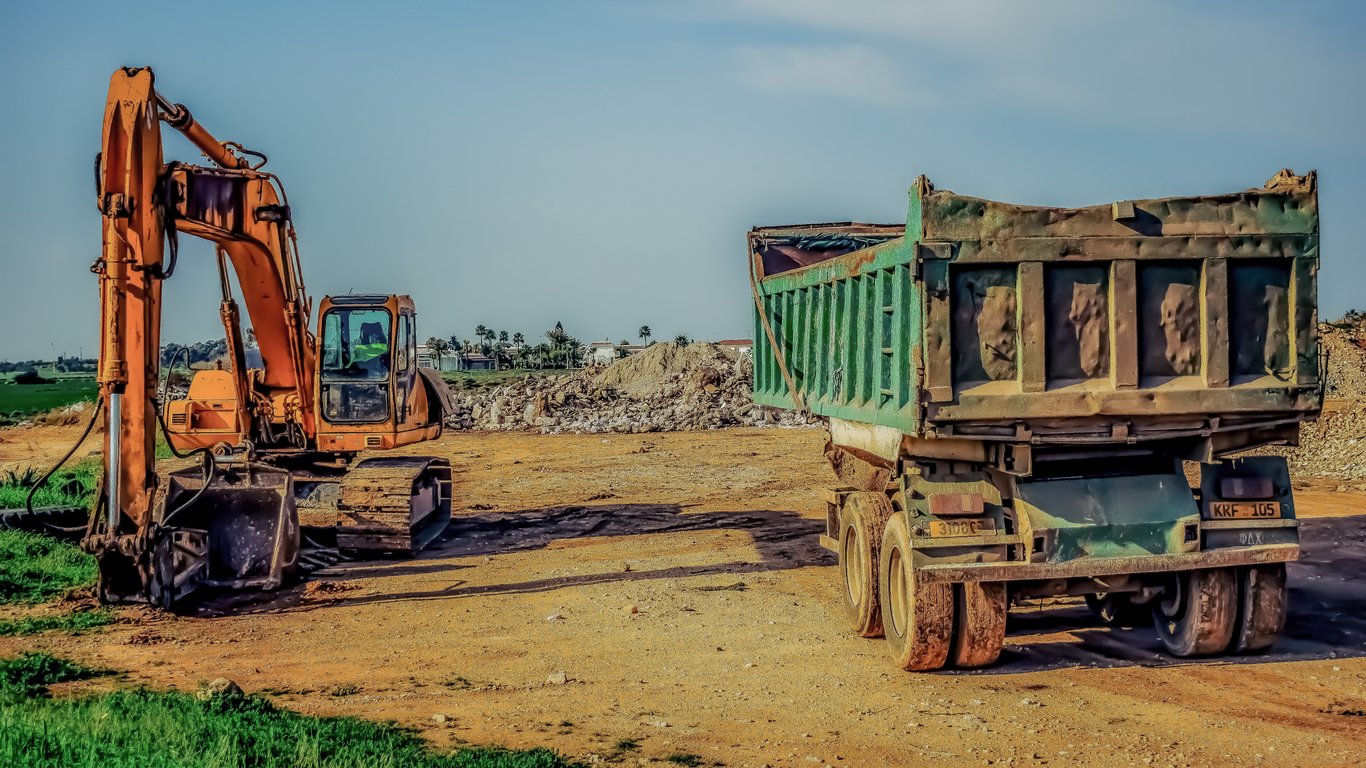 excavator on lowboy trailer