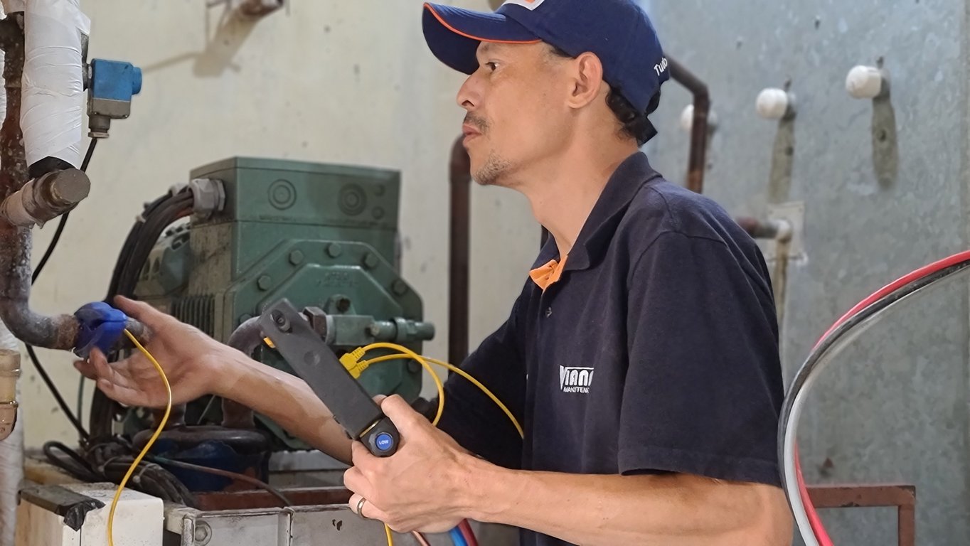 HVAC technician installing air conditioner