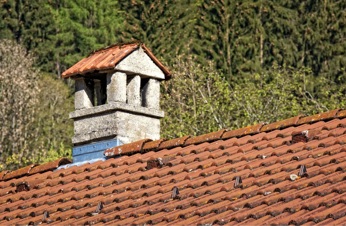 roofing contractor inspecting roof