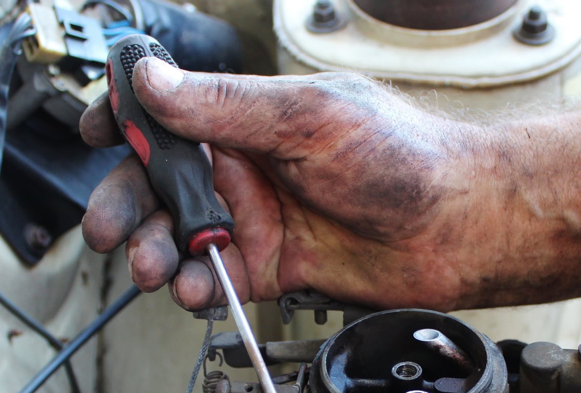 mechanic inspecting car brakes