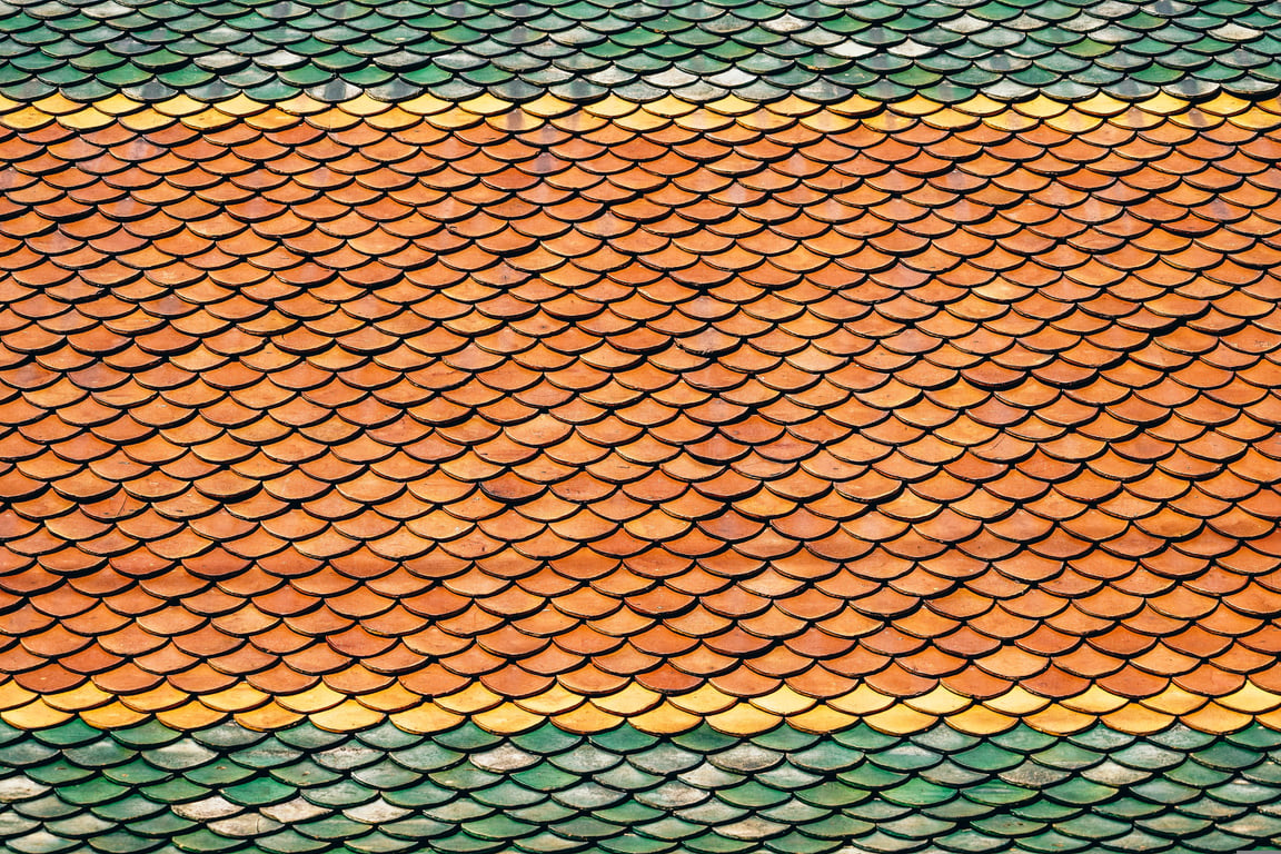 roofing contractor inspecting roof