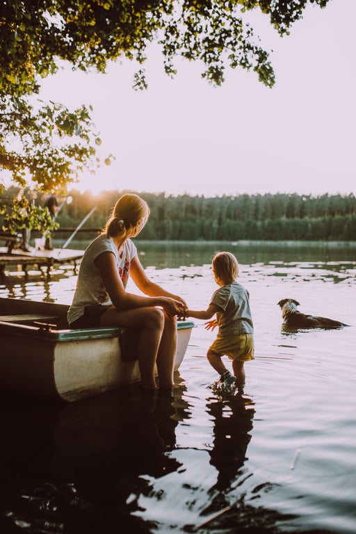 family pontoon boat on lake