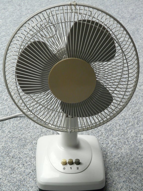HVAC technician inspecting air conditioner