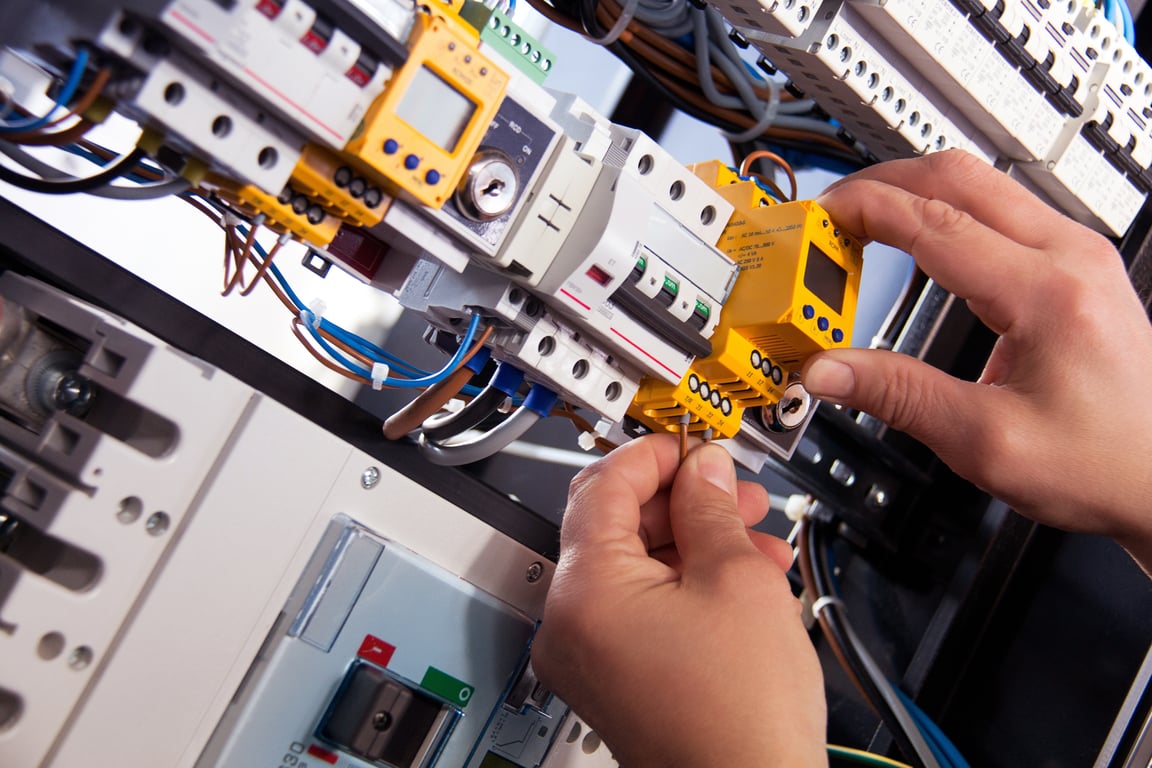 HVAC technician installing air conditioner