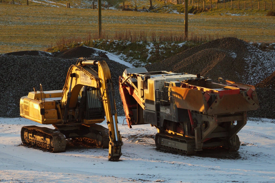 excavator loading dump trucks
