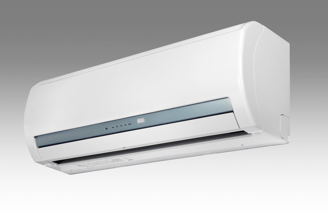HVAC technician repairing air conditioner