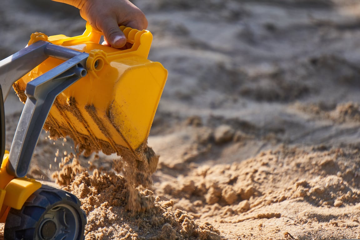 crawler excavator loading dump trucks