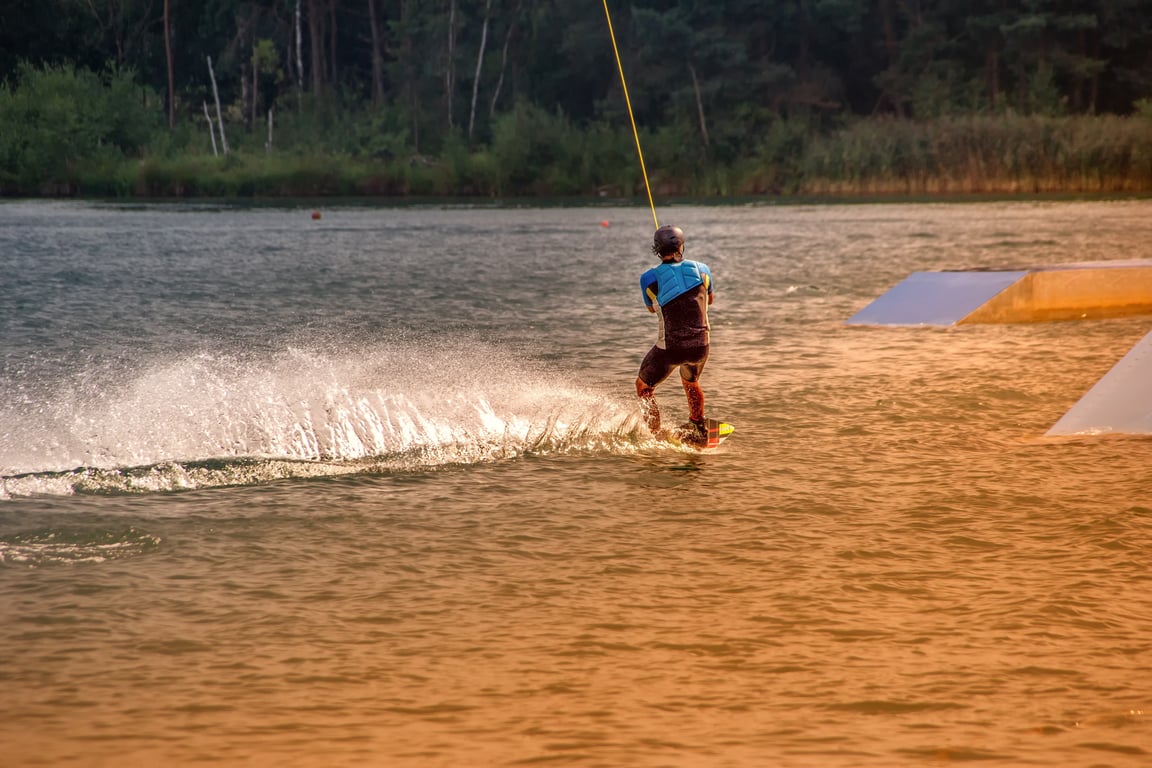 wakeboarding boat on lake