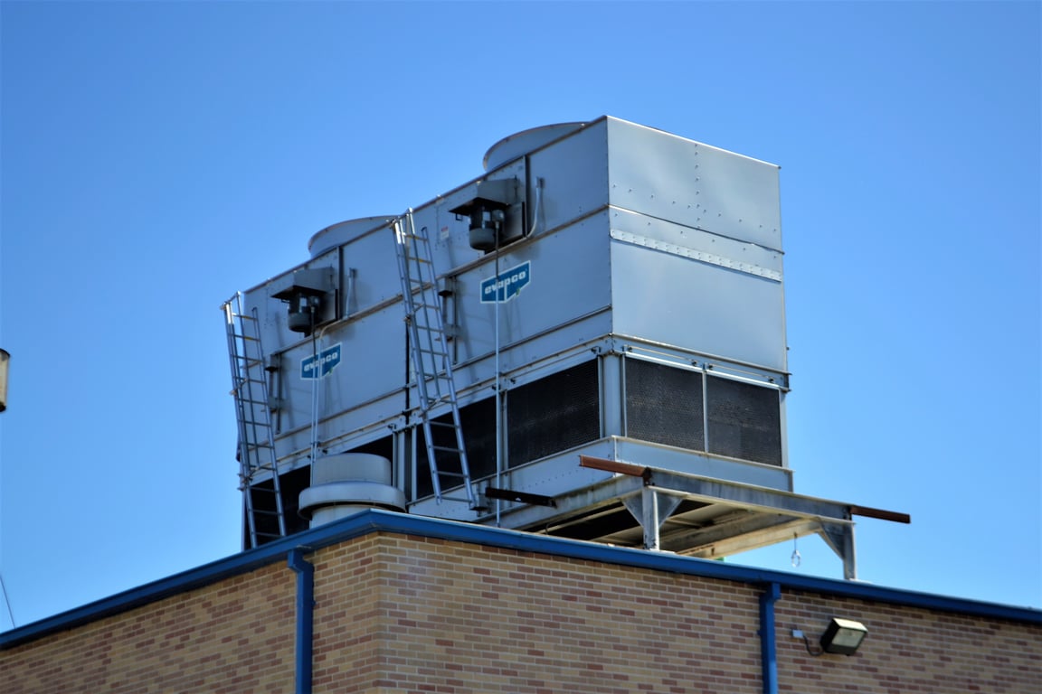 HVAC technician installing air conditioner