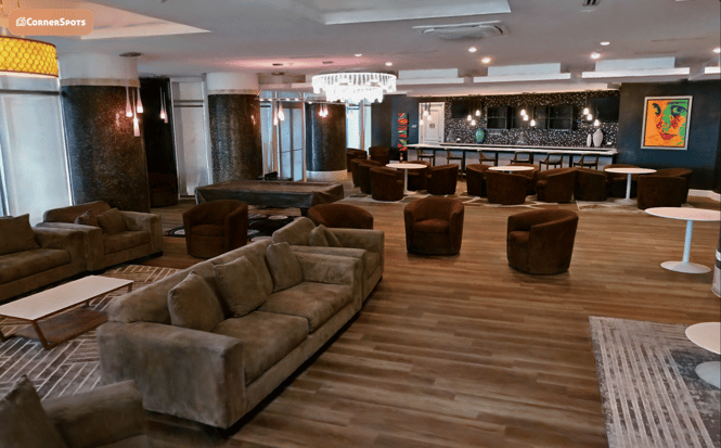 Residential common room lounge with sofas and café counter
