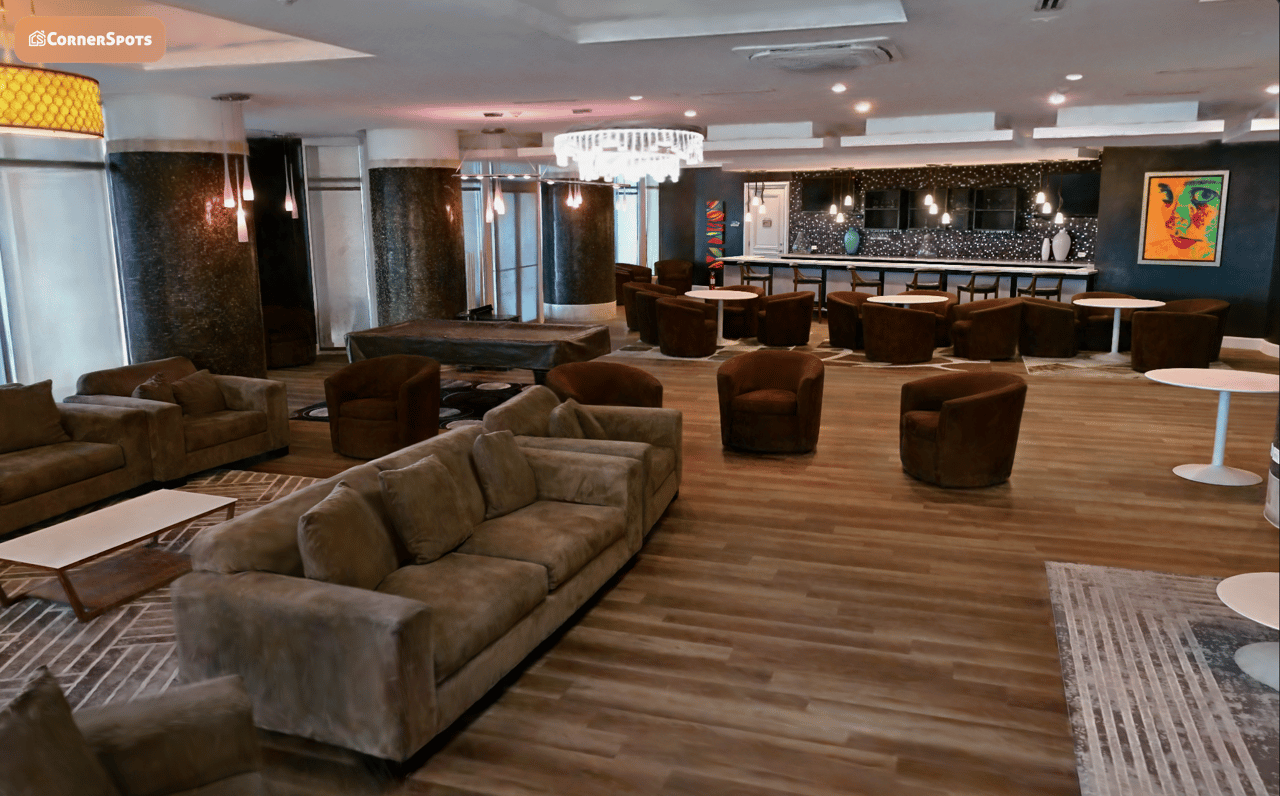 Residential common room lounge with sofas and café counter