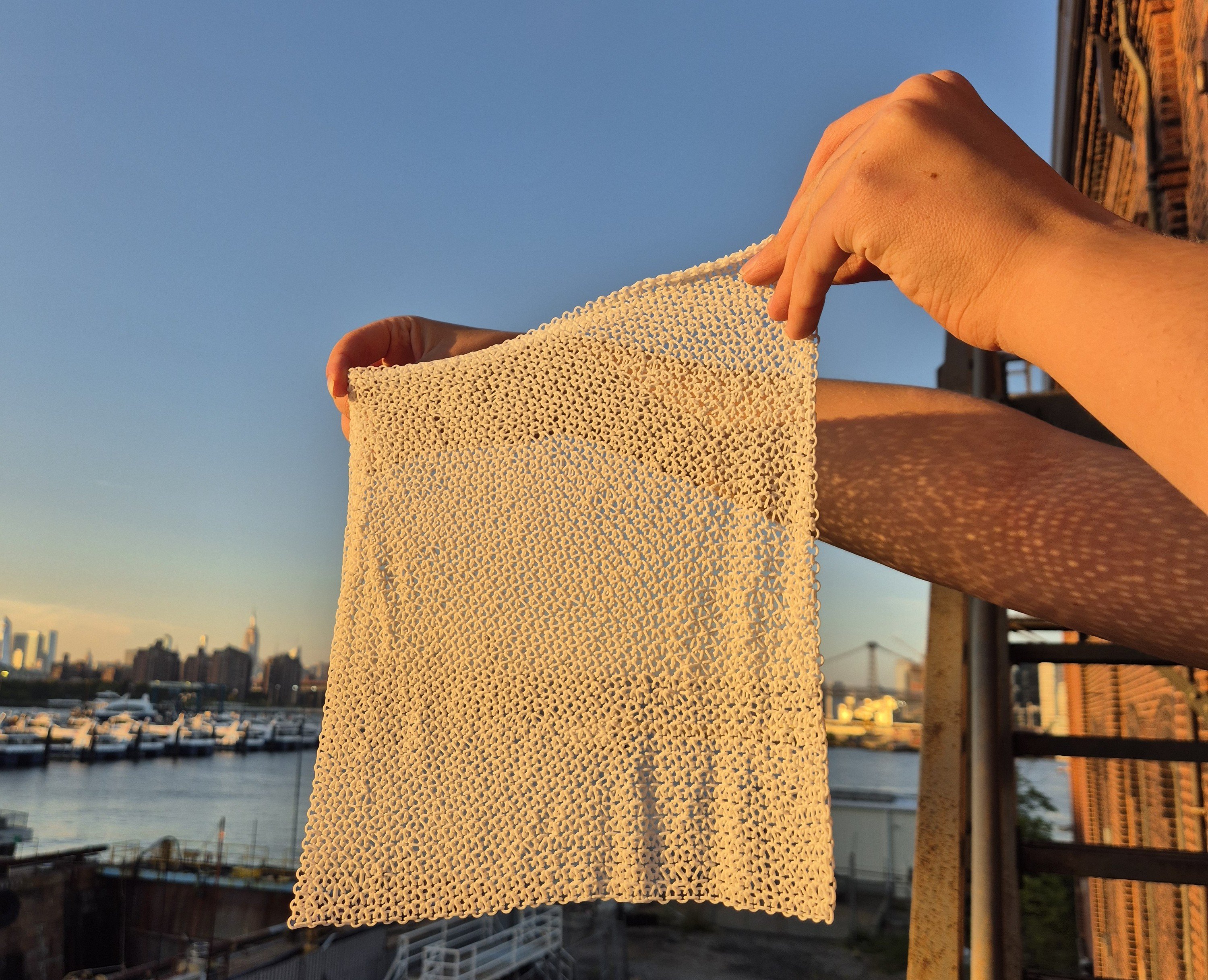 A sheet of chainmesh held up to the sky