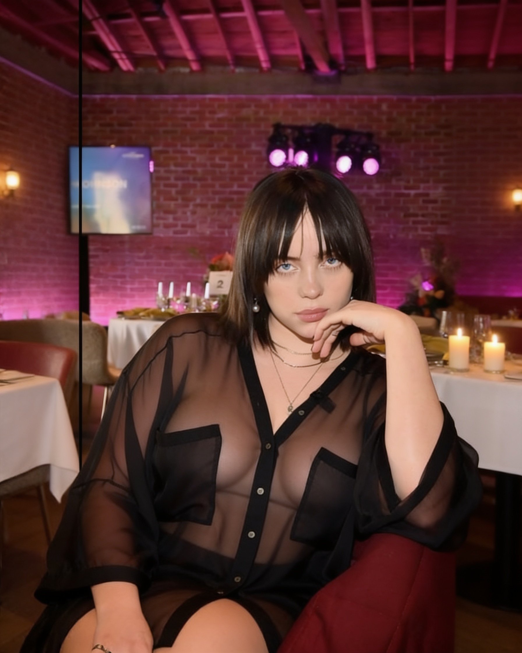 Use the woman reference for her identity and the clothing reference for the exact outfit. Create a natural seated portrait similar in presentation to the desired result: relaxed confident posture, one knee slightly raised, one hand resting naturally near her face, with enough separation between the arms and torso to clearly display the garment.
Dress her in the exact sheer black oversized garment from the clothing reference. Preserve its actual transparent smoky-black fabric, wide loose silhouette, V-shaped black neckline trim, center button strip, large angular black-edged pockets, wide sleeves, cuffs and naturally flowing hem. Do not redesign or simplify the garment.
The fabric must remain genuinely sheer and translucent, with the body silhouette naturally visible through it. Do not add any visible black bra, bandeau, camisole, tank top or bodysuit. Use discreet skin-toned coverage only where necessary.
Maintain a naturally fuller, feminine bust and chest contour with realistic anatomical volume and proportion. The sheer fabric should fall naturally over the chest and follow its three-dimensional shape with realistic tension, folds and draping. Do not flatten, compress, minimize or make the chest boxy. Keep the waist and overall body proportions natural and realistic.
Preserve her exact face, facial features, blue eyes, hairstyle, hair length, skin tone and identity. Keep the same restaurant environment, realistic lighting and candid photographic quality.
Do not make the garment opaque. Do not add visible underwear. Do not flatten the bust. Do not turn it into a regular fitted shirt. Do not create torn or fringed edges. Do not alter the garment design.