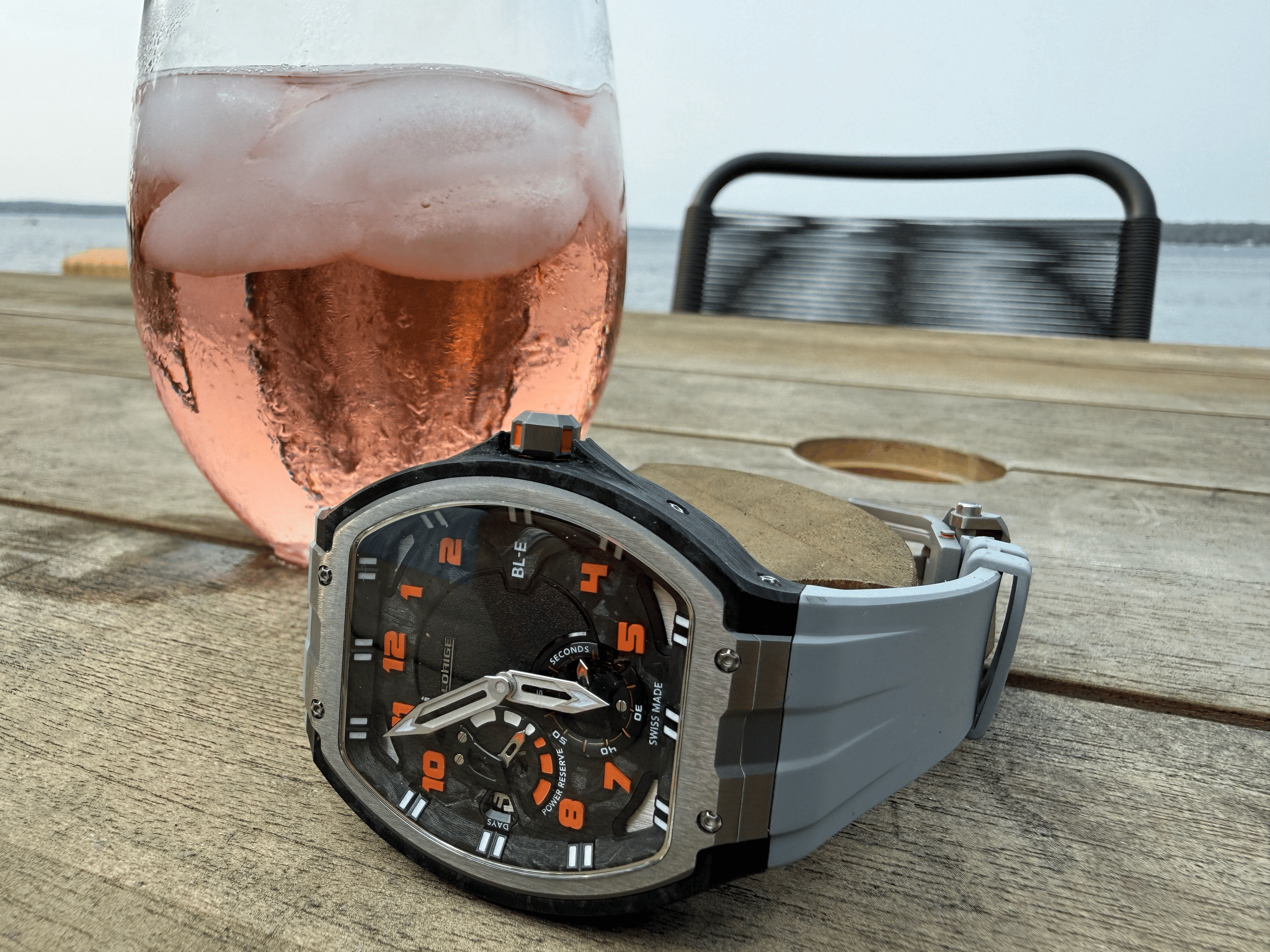 A wristwatch on a plain surface, used as the input photo for editing