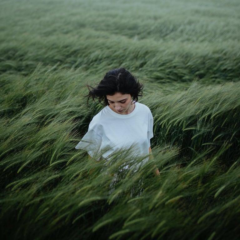 Create a cinematic, atmospheric editorial portrait using the attached photo as t