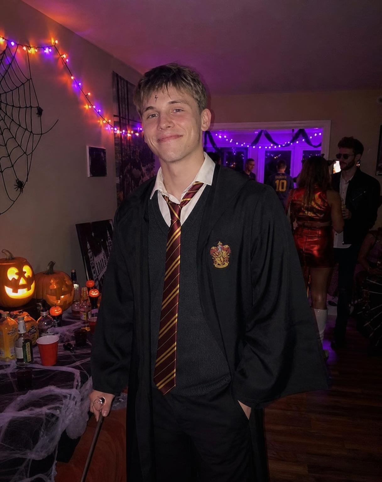 Create an ultra-realistic candid iPhone photograph of ME at a Halloween house pa