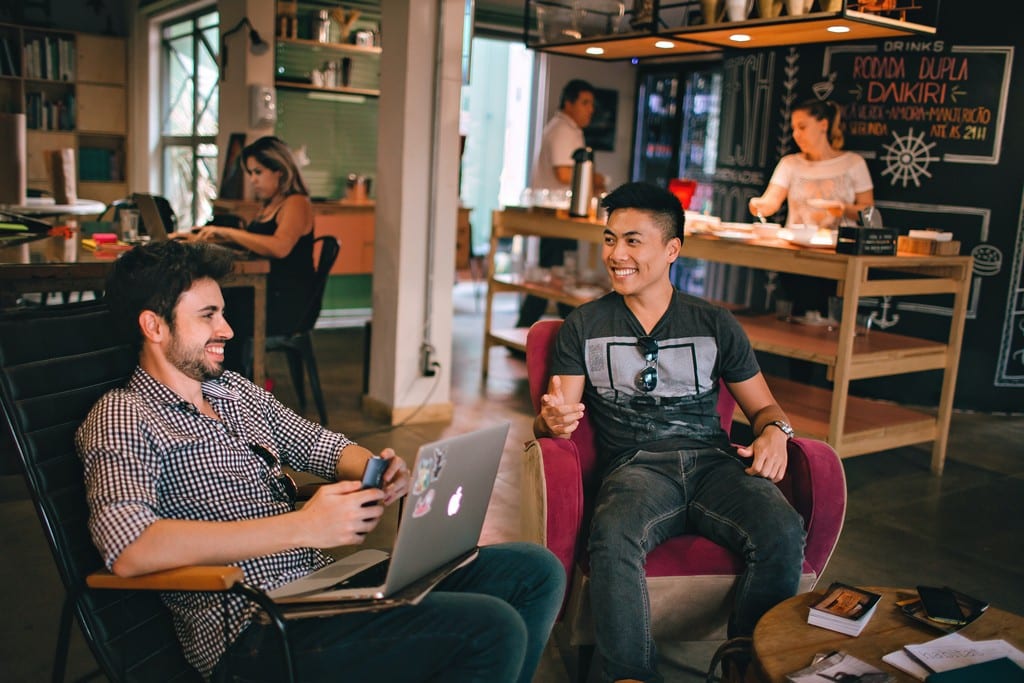 Men having conversation in coworking space