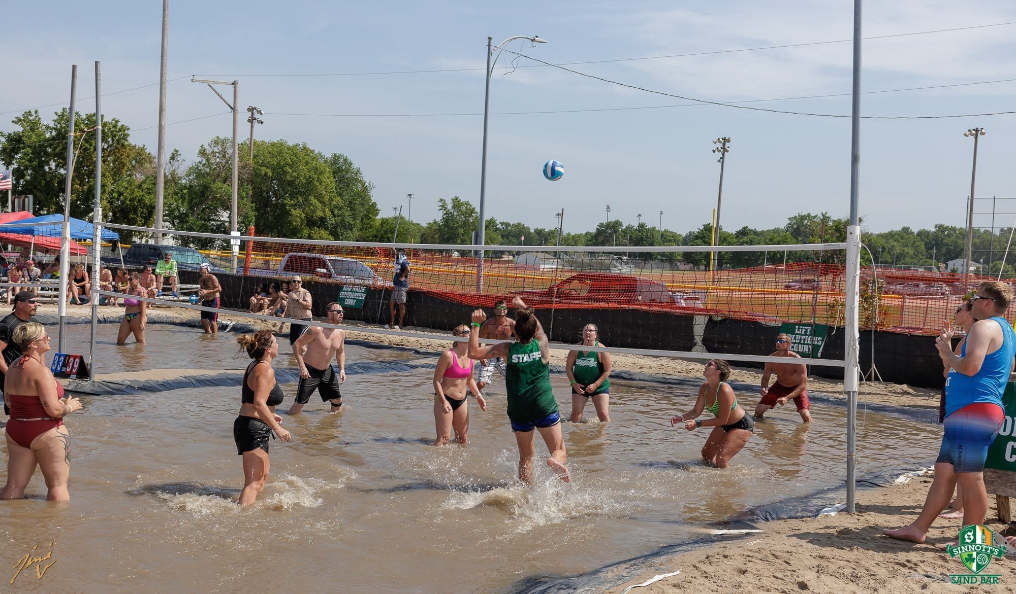 Patrons playing mud volleyball at MudBlast for CP. 
