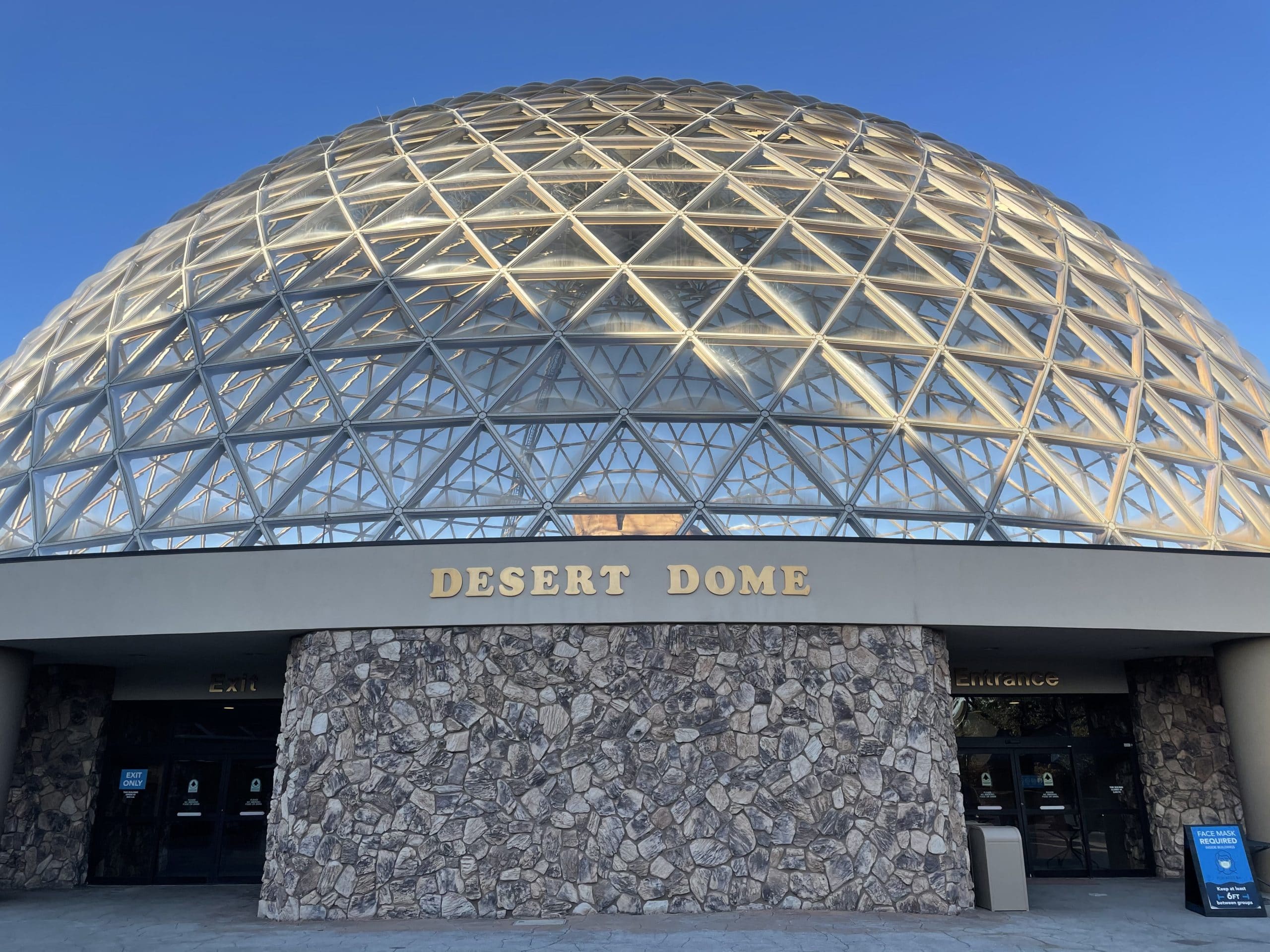 The geodesic desert dome called the "Desert Dome," which is printed on the front of the building. 