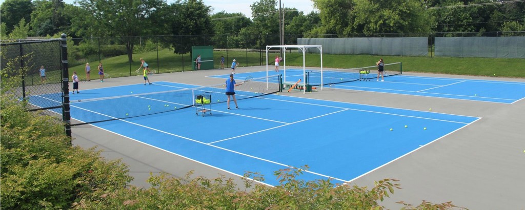 players on outdoor tennis court