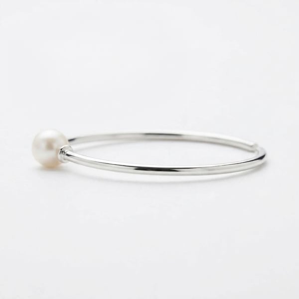 Side view — Raya Pearl Sleek Hoop Bracelet