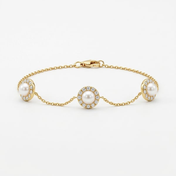 Studio shot of Kinana 18K gold chain anklet with three freshwater pearls surrounded by pavé halos on a white background.