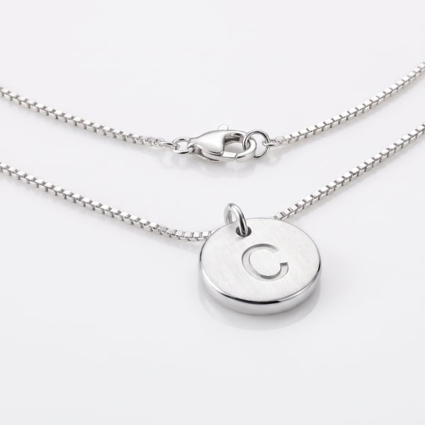 925 sterling silver kids necklace featuring an 8mm flat disc pendant stamped with the letter C on a delicate box chain